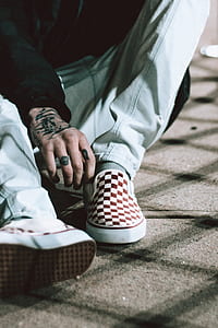 man wearing checkered slip-on shoes thumbnail