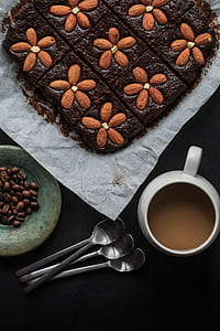 almond cake beside coffee mug thumbnail