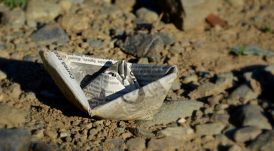 shallow focus photo of paper boat thumbnail
