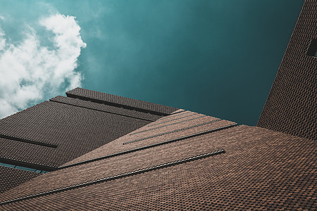 low angle photo of brown building thumbnail