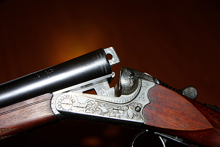 close-up photo of brown and gray flintlock gun thumbnail