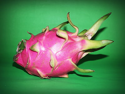 pink dragon fruit on green textile thumbnail