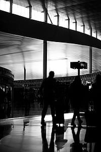 grayscale photography of people inside building thumbnail