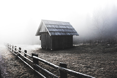 brown wooden house near fence thumbnail