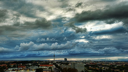 white clouds above buildings thumbnail