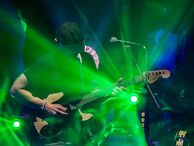 man playing guitar on stage thumbnail