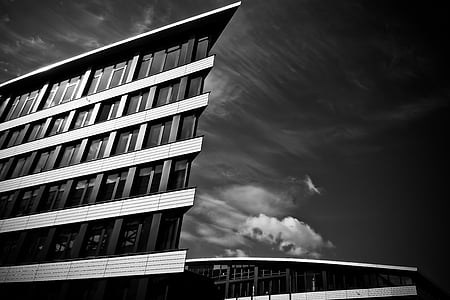 grayscale photo of corner side of the building thumbnail