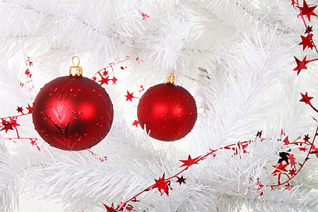two red baubles on white Christmas tree thumbnail
