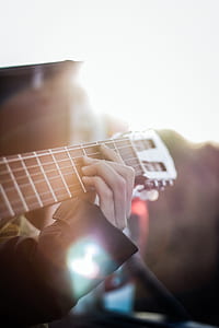 person playing classical guitar thumbnail