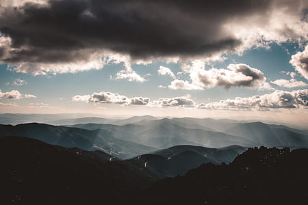 mountain under grey and blue sky thumbnail