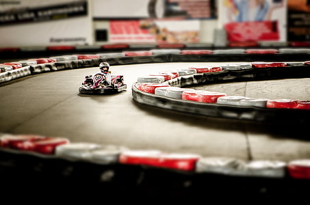 person riding go kart in race track thumbnail