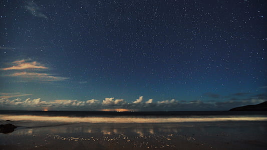 low angle photo of seashore under clear sky at daytime thumbnail