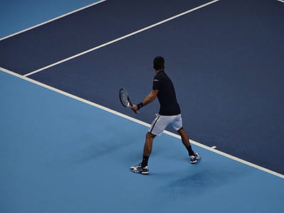 man holding tennis racket thumbnail