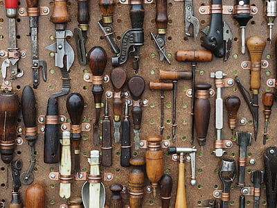 assorted handheld tool on brown surface thumbnail