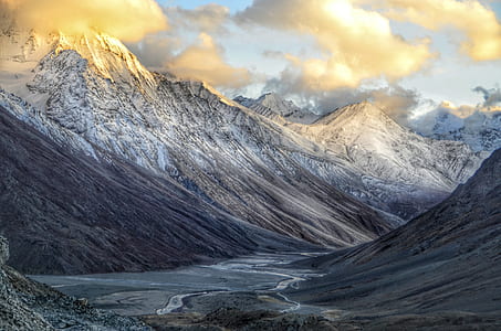 mountain covered white snow under white clouds thumbnail