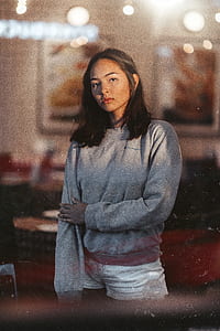 selective focus photograph of woman in gray sweater thumbnail