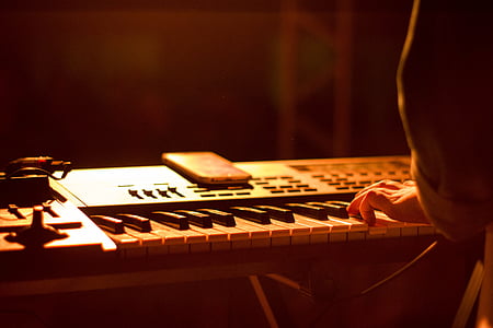 person holding electronic keyboard thumbnail