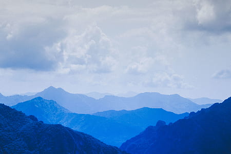 silhouette of mountains with gray clouds background thumbnail