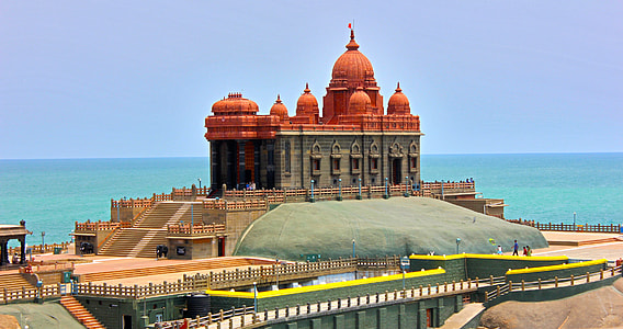 temple beside ocean under blue sky during daytime thumbnail