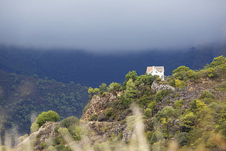 white and brown house on top of mountain thumbnail