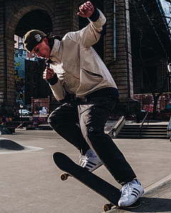 man skateboarding on street thumbnail