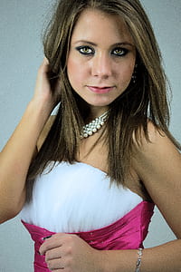 brunette woman wearing white and pink satin sleeveless dress thumbnail