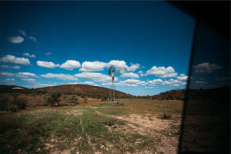 gray water pump in the middle of green field thumbnail