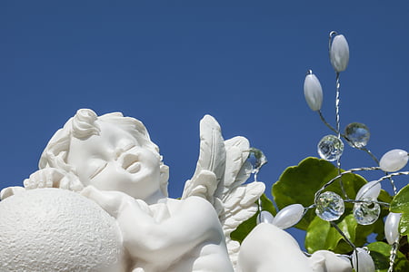 low-angle photography of cherub statue thumbnail