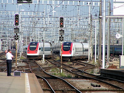 two train heading to the station thumbnail