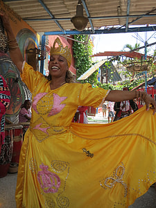 woman wearing yellow dress dancing on street during daytime thumbnail