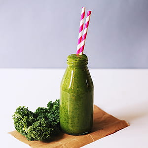 Clear Glass Bottle Filled With Broccoli Shake thumbnail