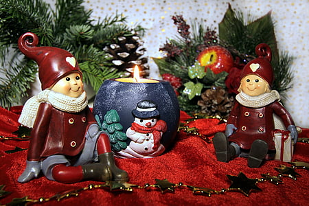 Christmas-themed decorations on red velvet surfacew thumbnail