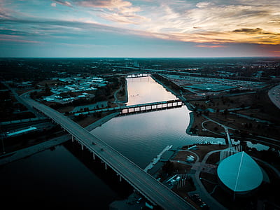 aerial photography of bridge above body of water during golden hour thumbnail