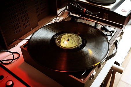 black vinyl record on gray turntable thumbnail