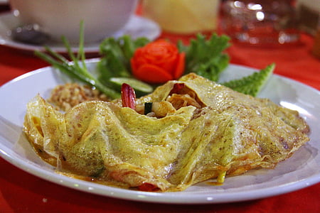 fried dish served on plate thumbnail