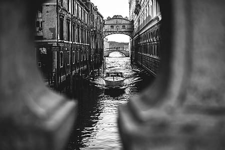 grayscale photo of speedboat in body of water thumbnail