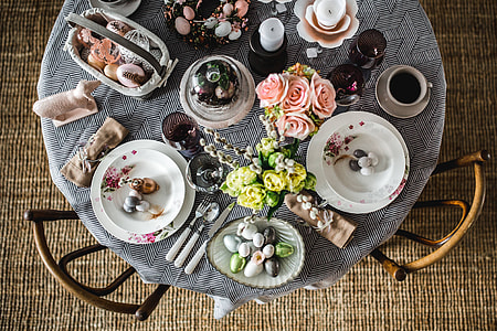 Round dinner table decorated with easter motifs thumbnail