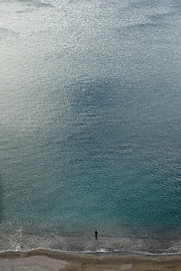 person standing on seashore thumbnail
