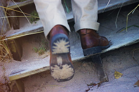 person wearing brown boots thumbnail