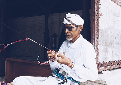 man holding red and black stick thumbnail