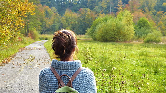 woman wearing green backpack thumbnail