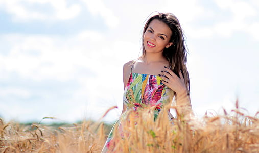 woman in pink and green dress thumbnail