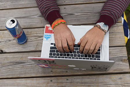 person using silver MacBook thumbnail