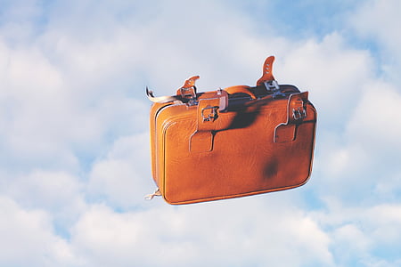 black leather bag falling from sky thumbnail