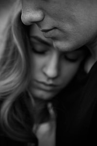grayscale photo of man and woman hugging each other thumbnail
