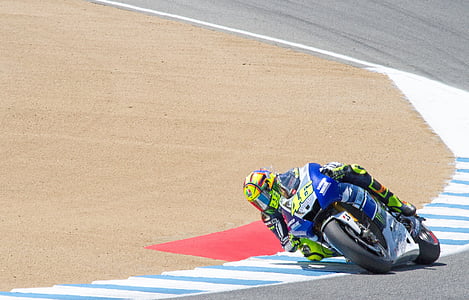 person driving blue and silver motorcycle on race track thumbnail
