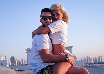 Woman Hugged the Man Sitting on Concrete Pavement thumbnail