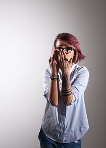 woman wearing white elbow-sleeved shirt covering her mouth thumbnail