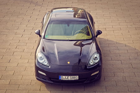 black Porsche Panamera parked on concrete pavement during daytime thumbnail