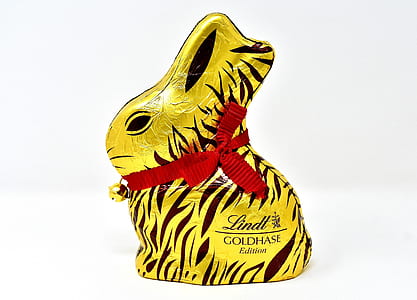 gold and black Lindt Goldhase Edition rabbit figure on white surface thumbnail